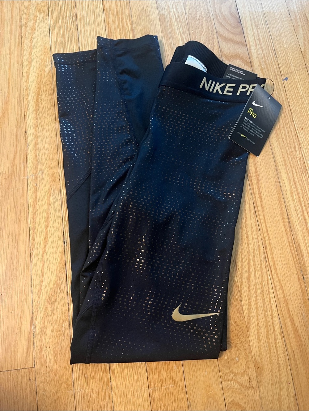 Nike Black Performance Leggings with Gold Swoosh